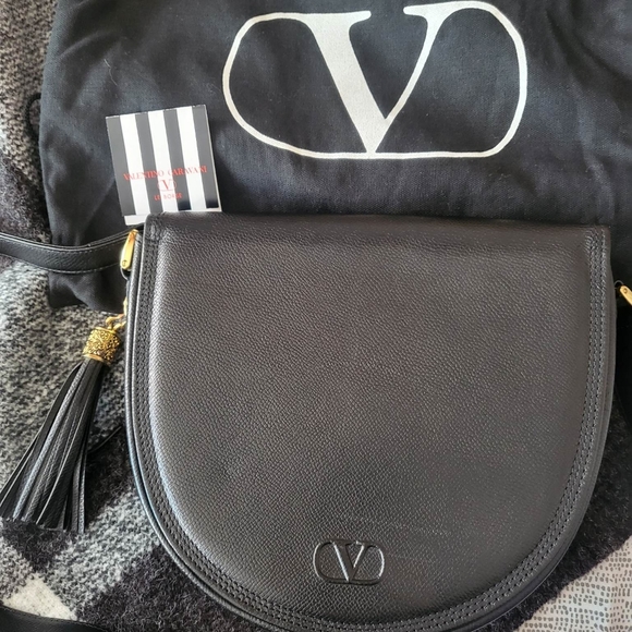 Valentino Garavani Handbags - Authentic Valentino Garavani V black leather saddle bag with tassel